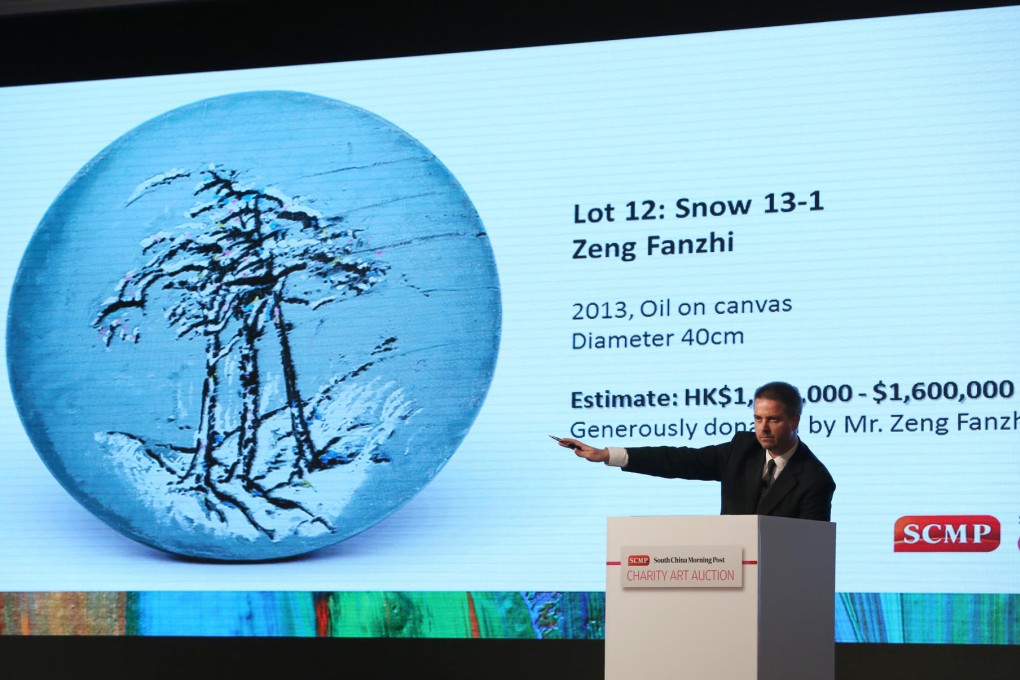 Bids are taken for Snow, a painting by mainland artist Zeng Fanzhi. It went under the hammer for HK$1.5 million. Photo: Nora Tam