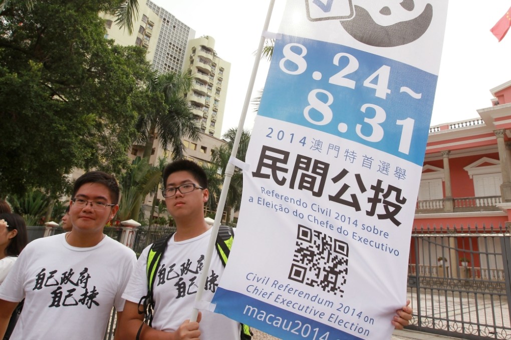 Concern group hold banner to urge people to vote in an civil referendum and protest against "small-circle" election in Macau. Photo: SCMP