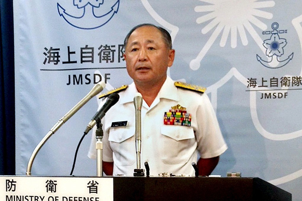 Katsutoshi Kawano, chief of staff of Japan's Maritime Self Defense Force (MSDF) speaking to the press about a sailor killed himself onboard his ship after being persistently bullied by a superior. Photo: AFP