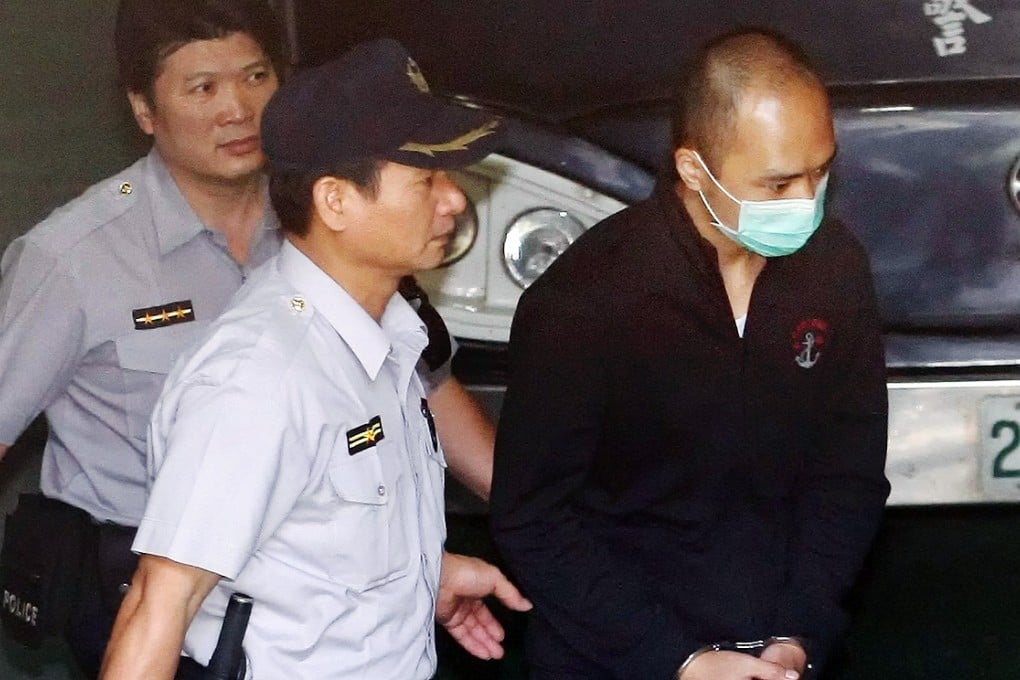 Justin Lee (right) is escorted to a court in Taipei for his verdict last year. He has been found guilty of rape by previous courts. Photo: CNA