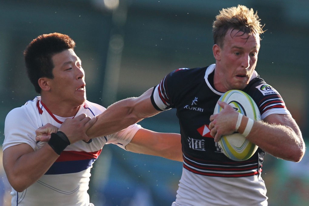 Alex McQueen on the charge during Hong Kong's 40-0 victory over South Korea to clinch the first leg of the Asian Sevens Series. Photos: Felix Wong/SCMP