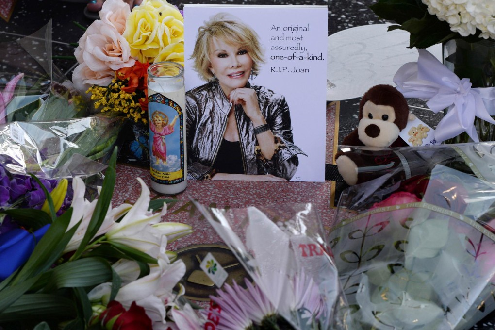 Flowers on Joan Rivers' star on the Hollywood Walk of Fame. Rivers joked about America's obsession with image. Photo: AP