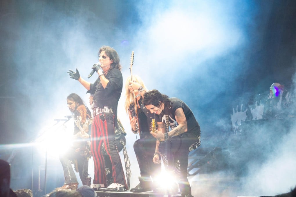 One last time: Alice Cooper (with microphone) opens for Mötley Crüe at the Hollywood Bowl on their final tour. Photos: Corbis, Redferns