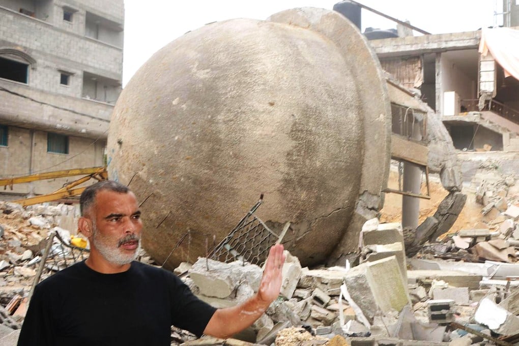 A man stands in front of what was once a Gaza mosque. Eyal Weizman's team has looked into Israel's "knock on roof" warnings. Photo: Kyodo