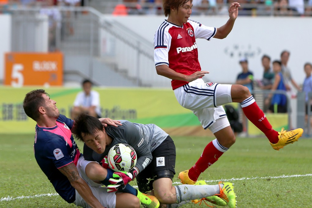 Kitchee's Alexander Akande celebrates with fans after the club won last season's Hong Kong First Division League. Photo: Felix Wong