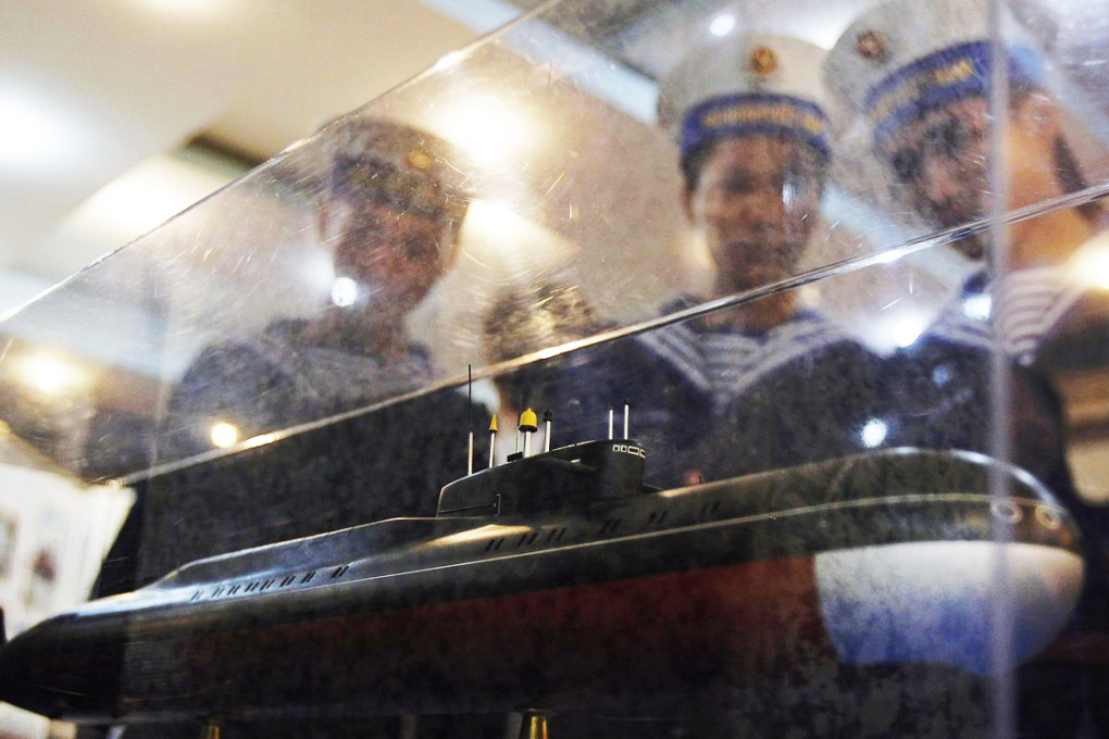 Sailors look at a model of a submarine in Vietnam's northern port city of Hai Phong, in this 2011 file picture. Photo: Reuters