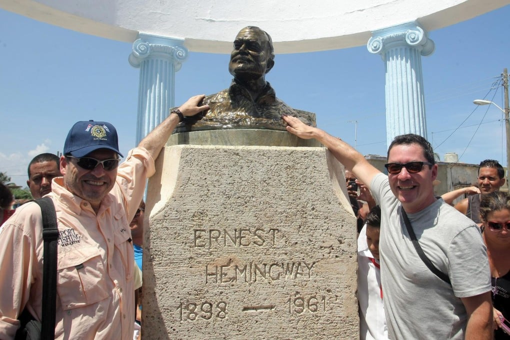 John (left) and Patrick Hemingway with a bust of 'Papa'. Photo: EPA