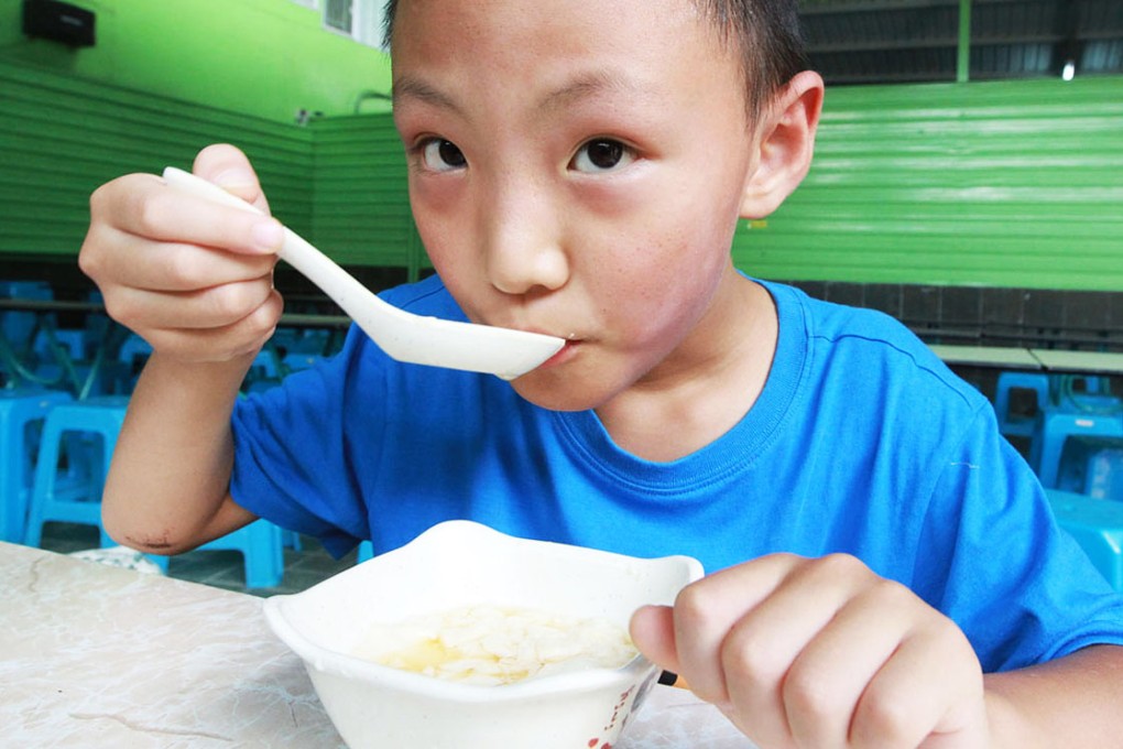 Proof in the pudding: a boy tucks into a bowl of tofu pudding at GuGuSoy. Photo: Edward Wong