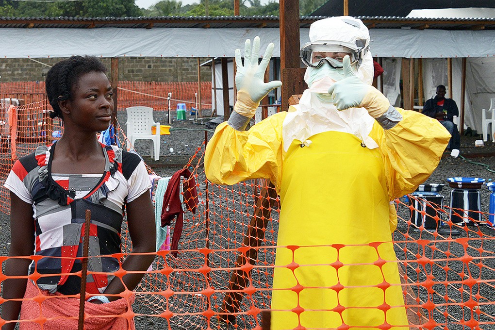 A medical worker treats Ebola patients at a hospital in Monrovia. Photo: AFP