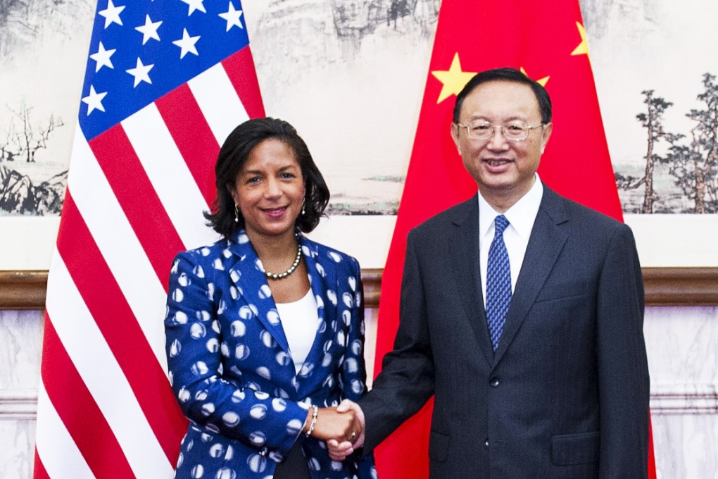 Susan Rice shakes hands with State Councillor Yang Jiechi at the Diaoyutai State Guesthouse in Beijing on Monday. Photo: Xinhua