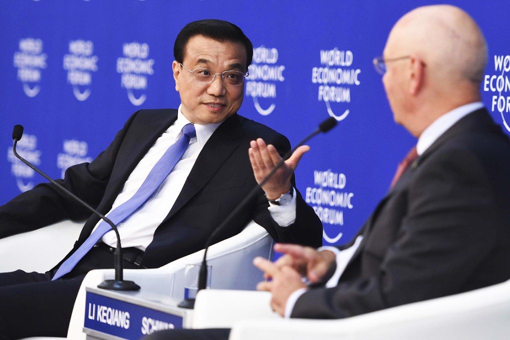 Li Keqiang and Klaus Schwab at the forum in Tianjin. Photo: Xinhua