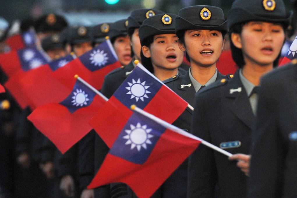 Students of a military school wave the national flag. Taiwan has been rocked by a series of espionage scandals despite warming ties with Beijing. Photo: AFP