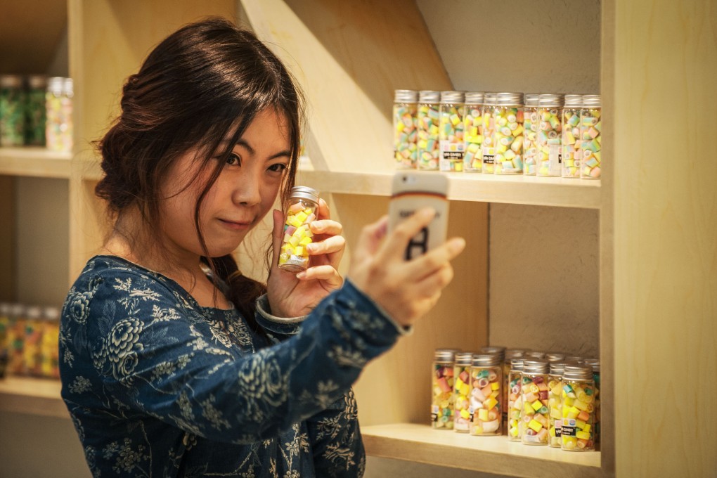 Selfies may be a global trend, but many beauty-enhancing selfie apps are made in Asia. Photo: Xinhua