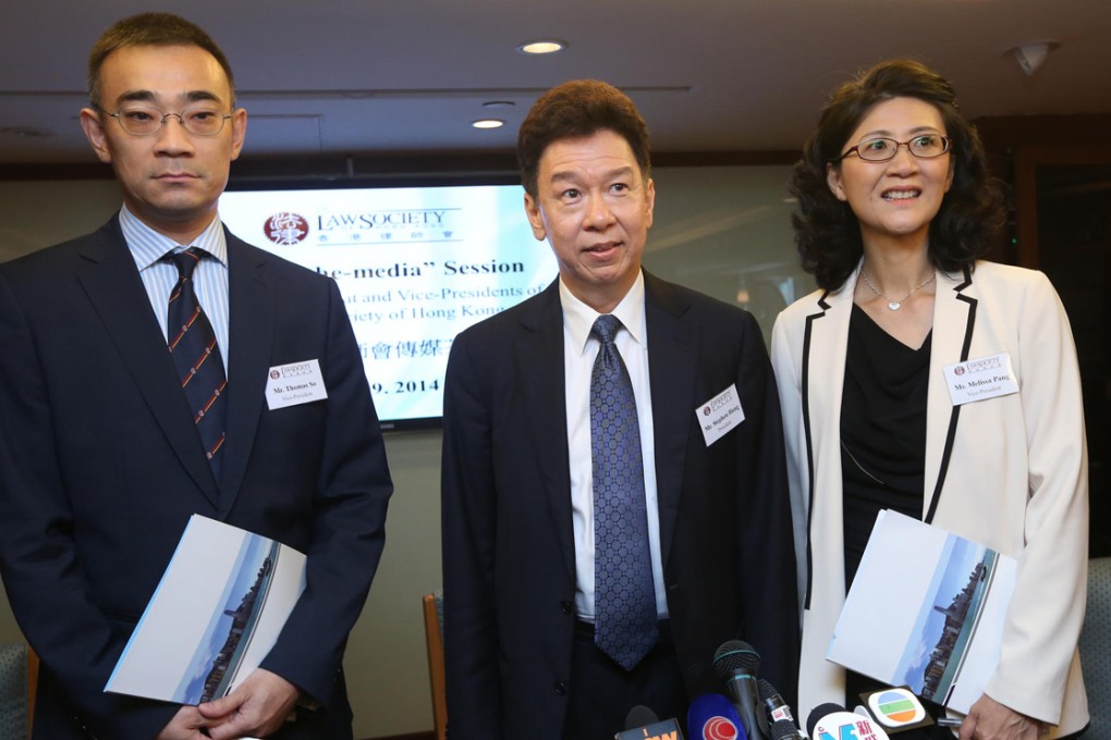 Law Society president Stephen Hung (centre) with his deputies Thomas So and Melissa Pang in Central yesterday. Photo: Sam Tsang