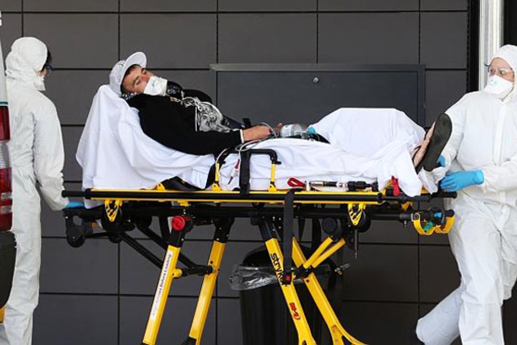 A man suspected of having the Ebola virus arrives at the Emergency department of the Gold Coast University Hospital. Photo: Gold Coast Bulletin