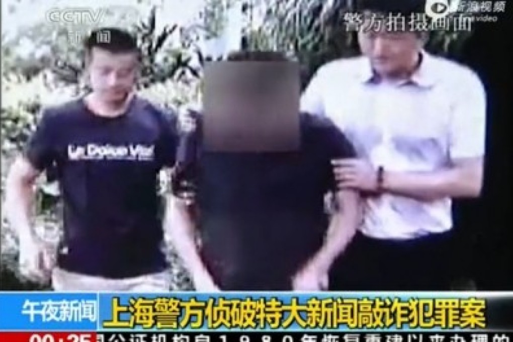 One of the eight suspects detained by police in connection with the extortion scheme. Photo: SCMP Pictures