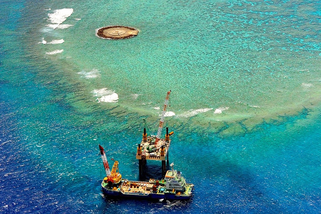 A facility to unload supplies, fuel and water is being constructed at remote Okinotorishima. Photo: Asahi Shimbun