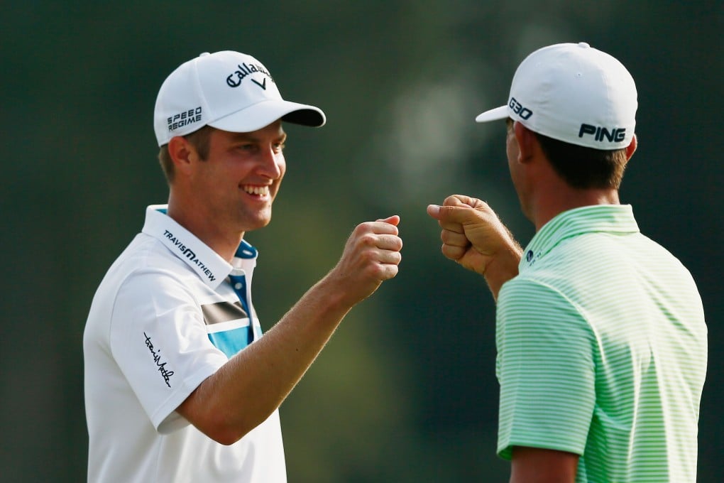 Billy Horschel and Chris Kirk bump fists. Photo: AFP