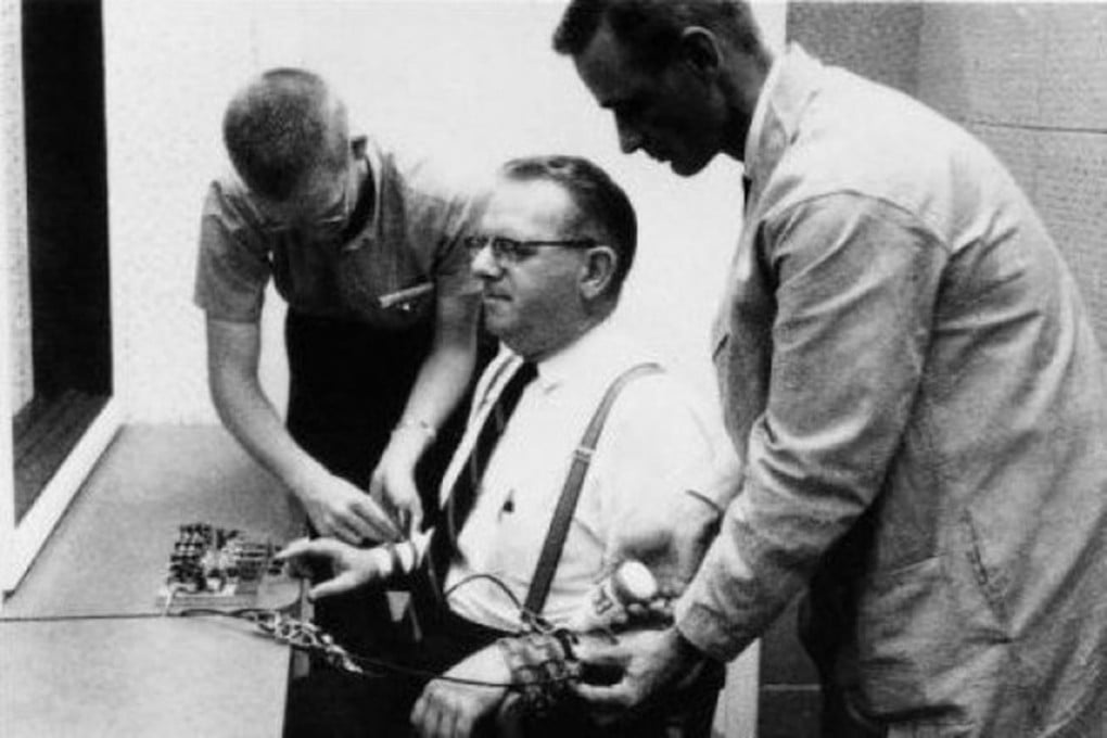 A participant is strapped into his chair and equipment during the famous Milgram experiments in 1961 at Yale University. Photo: SMP