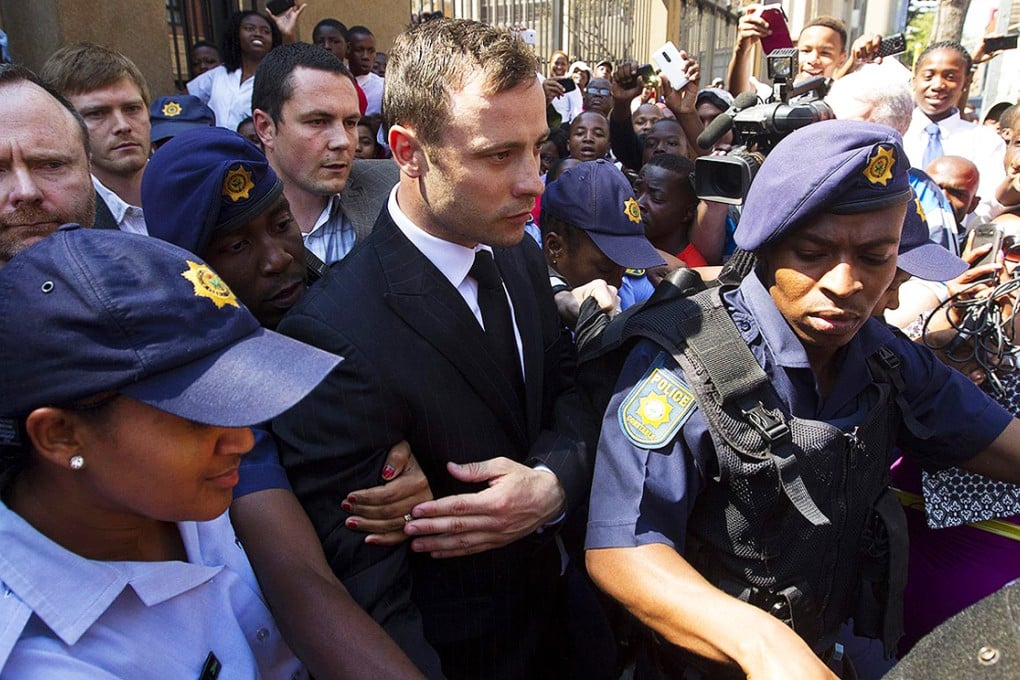 Oscar Pistorius leaves court in Pretoria after being found guilty of negligently killing his girlfriend. Sentencing is next month. Photo: Reuters