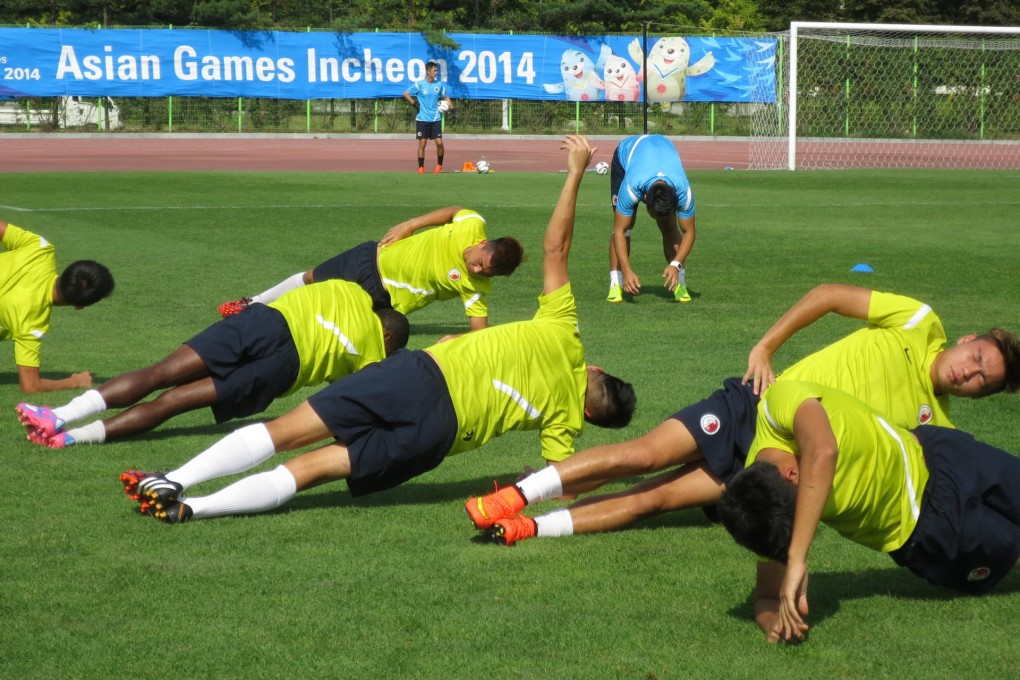 Hong Kong players limber up in training in preparation for their opener against Uzbekistan at the Asian Games. Photo: Chan Kin-wa