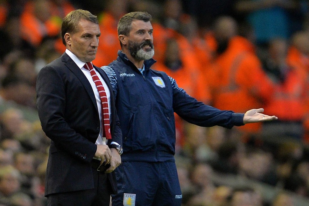 Brendan Rodgers looks on with Aston Villa assistant manager Roy Keane. Photo: EPA
