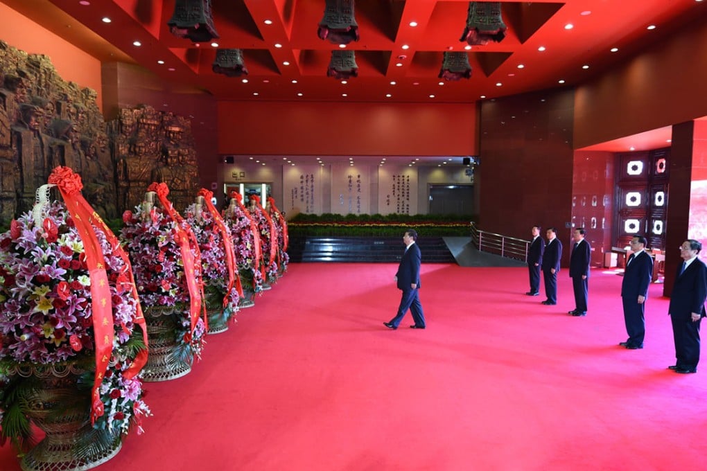 China's top leaders present flower baskets to martyrs who sacrificed their lives in the Anti-Japanese War. Photo: Xinhua