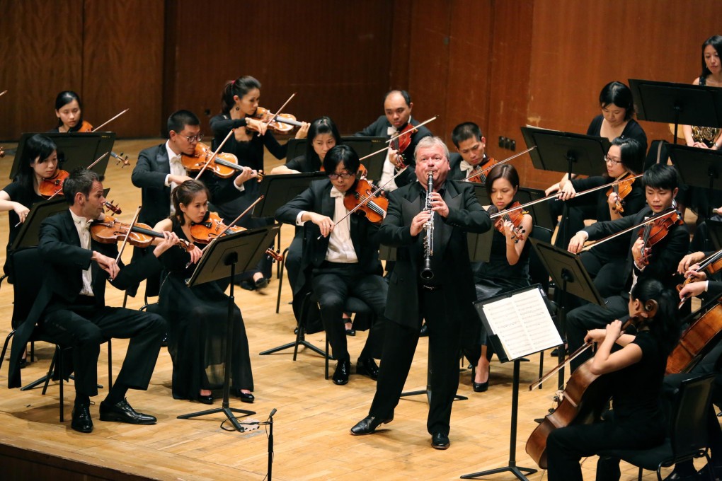 Sinfonietta conductor Michael Collins solos on basset clarinet.