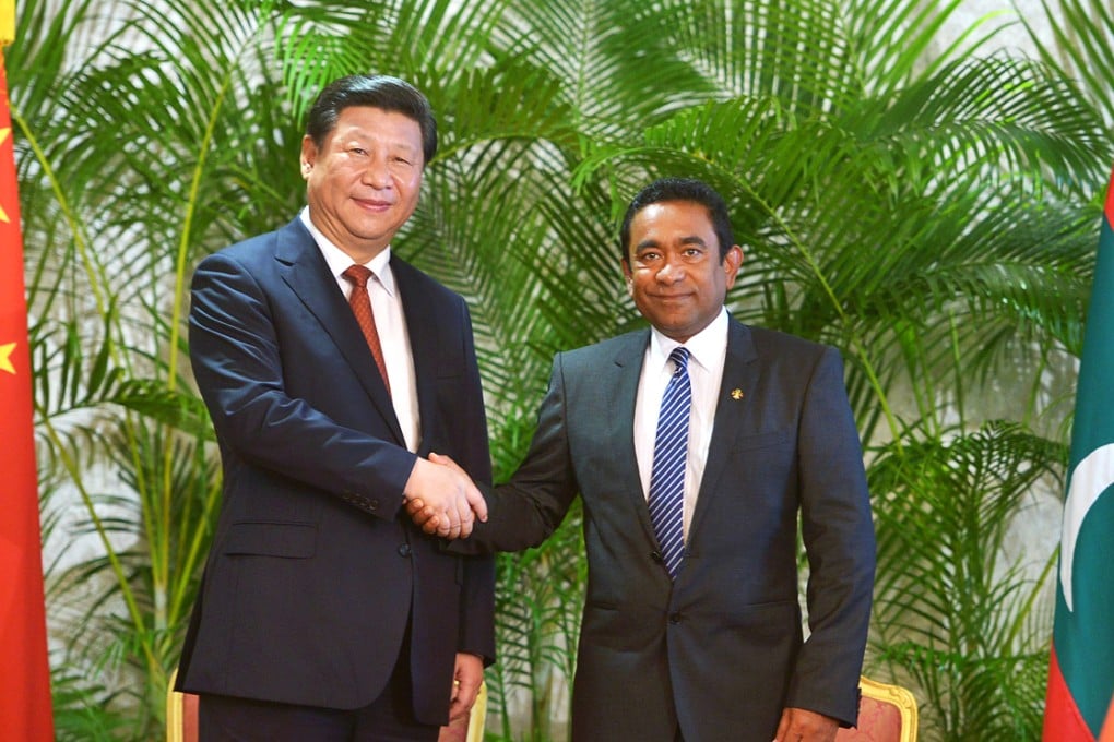 Visiting Chinese President Xi Jinping (left) shakes hands with Maldives President Abdulla Yameen at the President's Office in the capital island Male. Photo: AFP