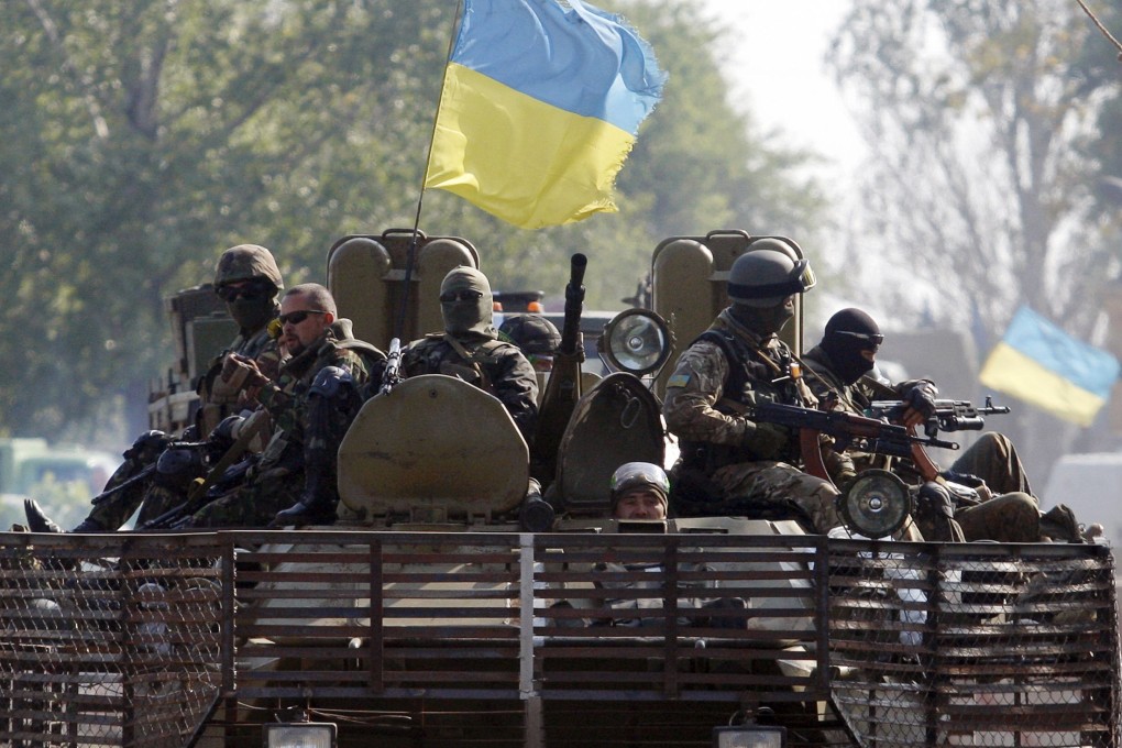 Ukrainian servicemen patrol the Donetsk region in the restive east. Photo: AFP