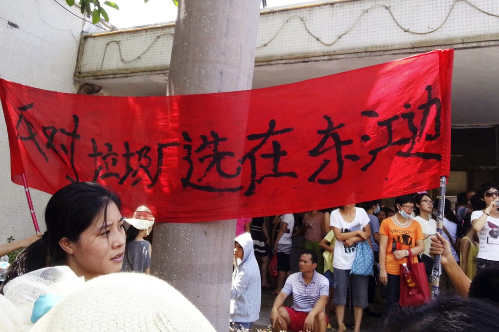 Protesters oppose an incinerator project in Boluo county, Guangdong, on Sunday. Photo: AP