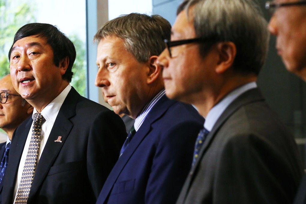 Professor Joseph Sung, flanked by fellow university leaders, speaks after yesterday's meeting with government officials. Photo: Felix Wong
