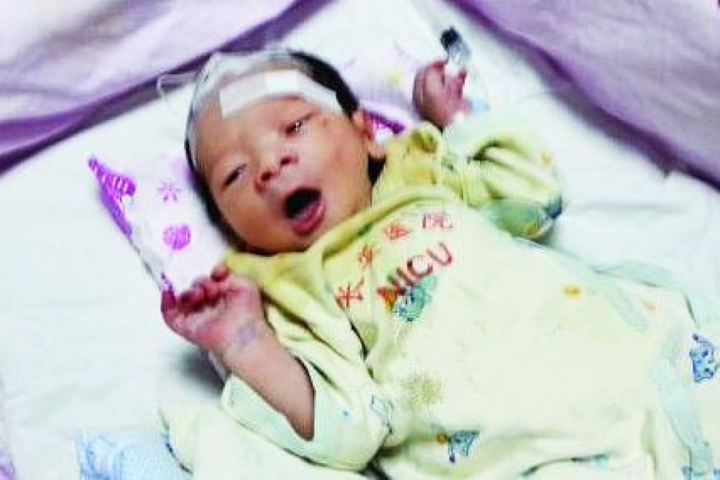 The infant was bruised and naked when it was found by a resident, and was rushed to hospital for treatment. Police named the baby Haiou. Photo: SCMP Pictures
