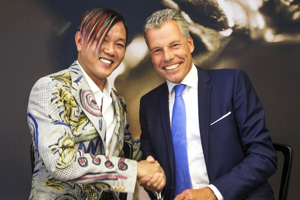 Stephen Hung and Torsten Mueller-Oetvoes, CEO of Rolls-Royce Motor Cars signed the deal on Tuesday in England. Photo: Louis XIII