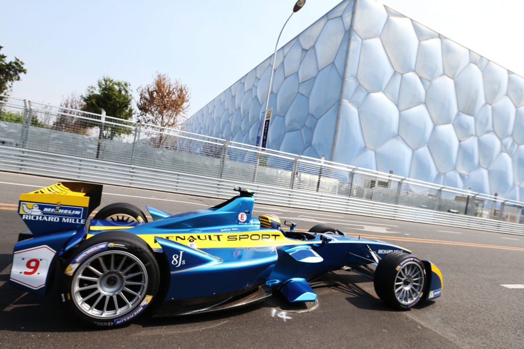 Swiss driver Sebastian Buemi of E. Adams Renault Formula E team in action in front of the Water Cube. Photo: EPA