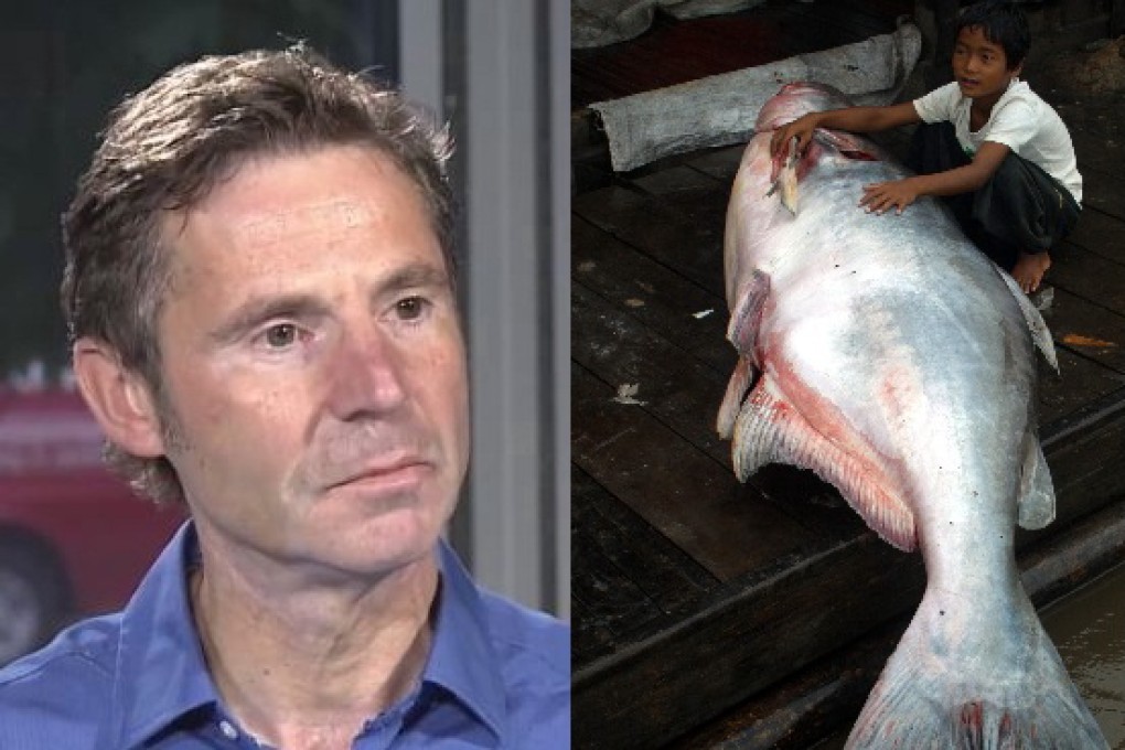Bradley Saltzberg and an Asian catfish. Photos: Shaw TV, EPA