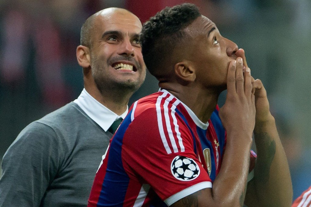 Jerome Boateng celebrates as Pep Guardiola looks on. Photo: EPA