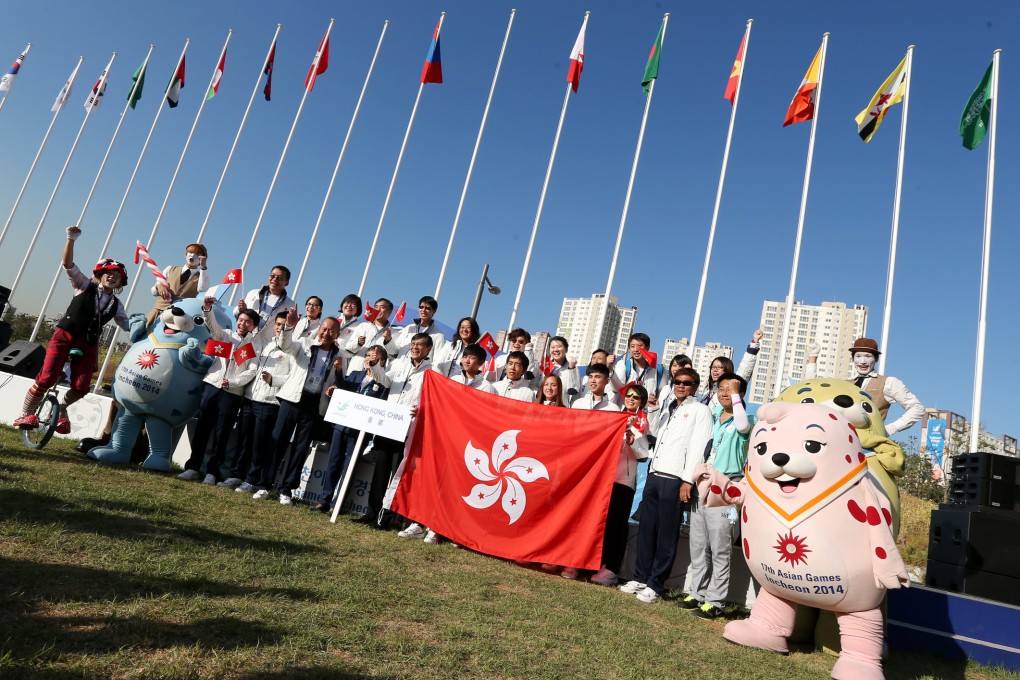 Members of the Hong Kong team attend a flag-raising ceremony at the athletes' village in Incheon. Photos: Nora Tam
