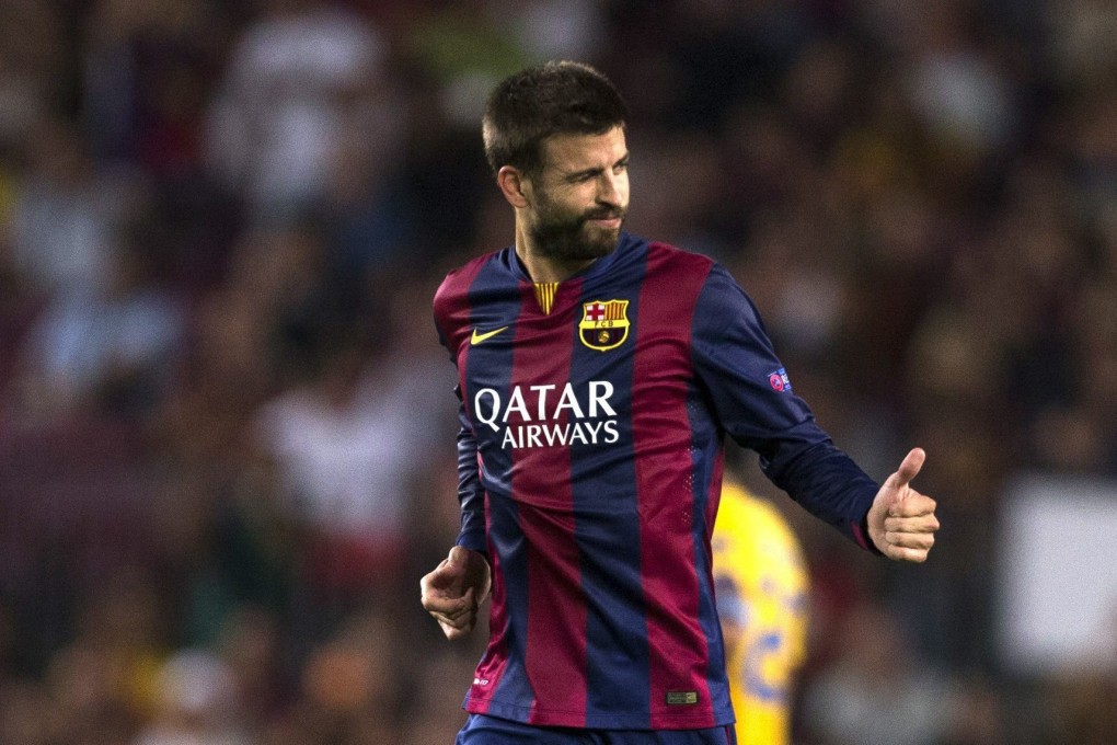 Gerard Pique celebrates Barca's winner. Photo: EPA