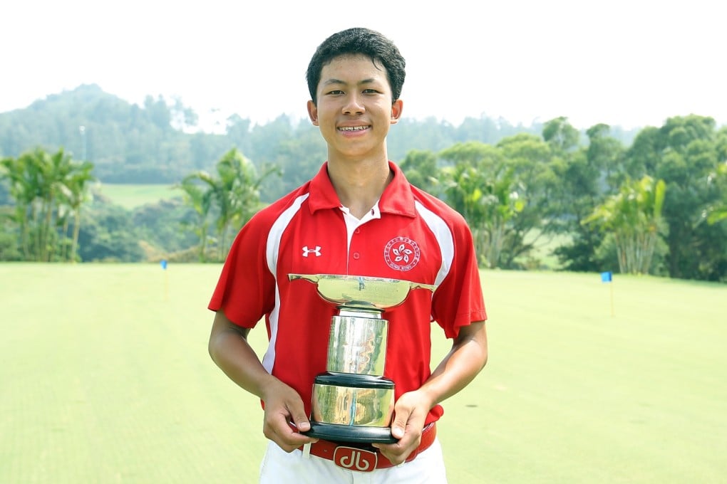 Michael Wong is beaming as he collects his trophy. Photo: Daniel Wong