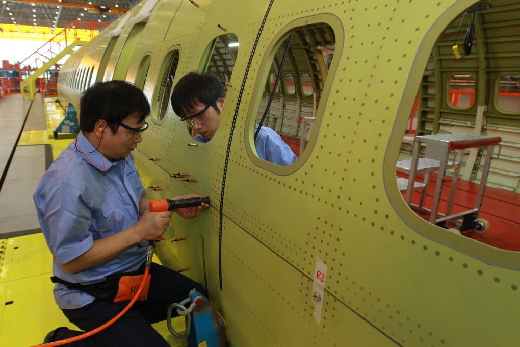 Assembly of the country's first large passenger jet, the C919, begins at the Commercial Aircraft Corporation of China's base in Shanghai on Friday. Photo: Xinhua