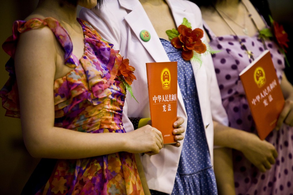 Copies of the constitution are distributed. Photo: Shiho Fukada