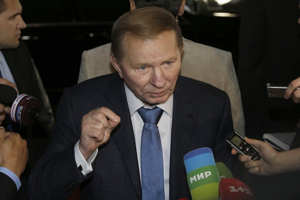 Former Ukrainian president Leonid Kuchma speaks to the media as he arrives to take part in peace talks in Minsk, Belarus on Friday. Photo: AP