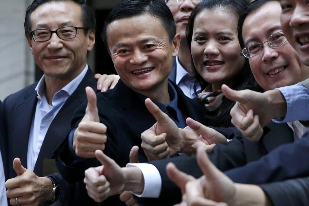 Alibaba founder Jack Ma (second from left) has plenty to smile about as he arrives at the New York Stock Exchange for the IPO. Photo: Reuters