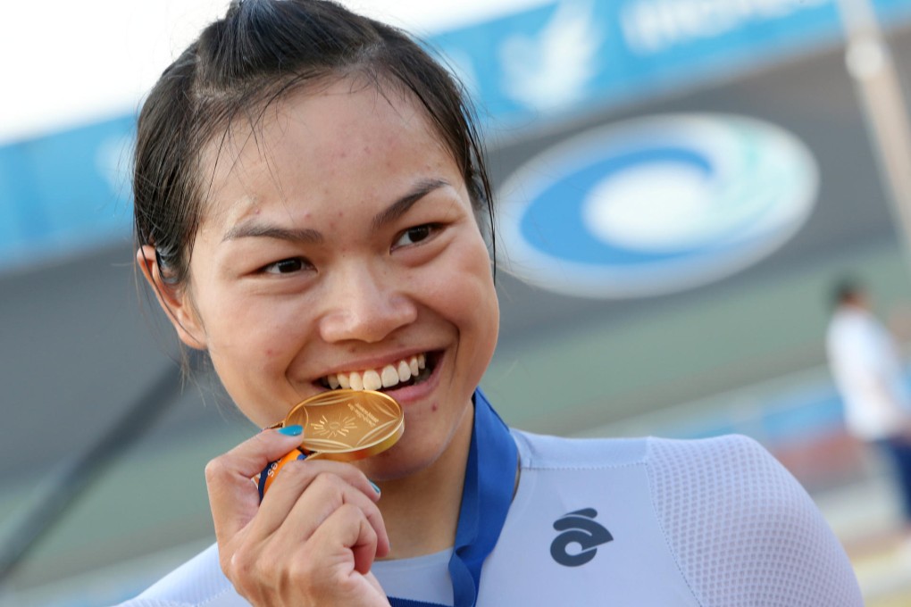 A delighted Sarah Lee shows off her gold medal after destroying the field in the women's keirin in Incheon to add to her triumph in Guangzhou four years ago. Photos: Nora Tam