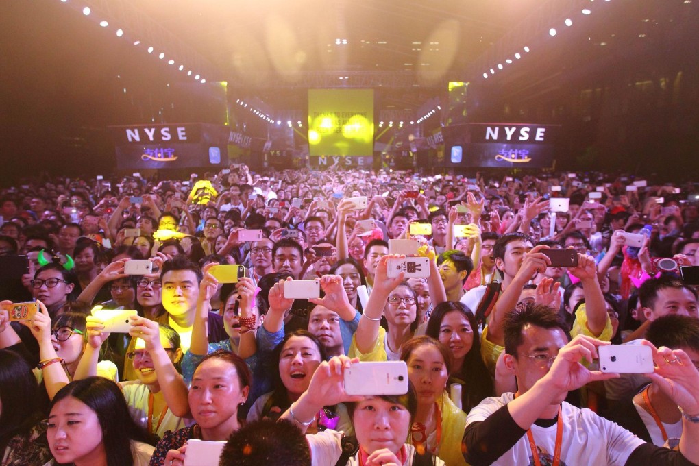 Alibaba staff celebrate at the company's headquarters. Photo: AFP