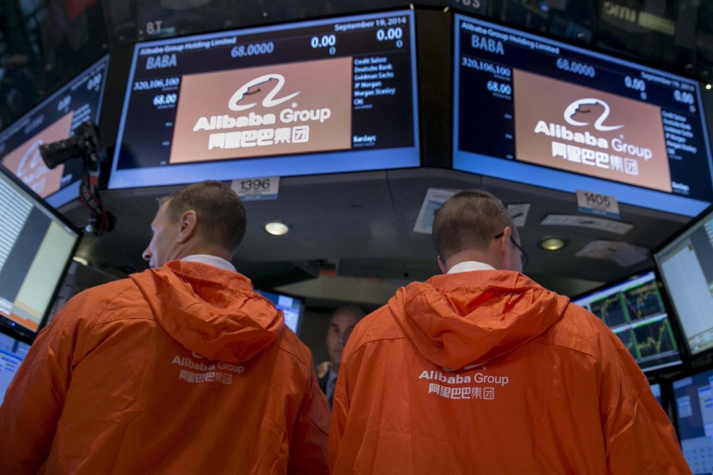 Traders work on the floor of the New York Stock Exchange during Alibaba's initial public offering last Friday. Photo: Reuters