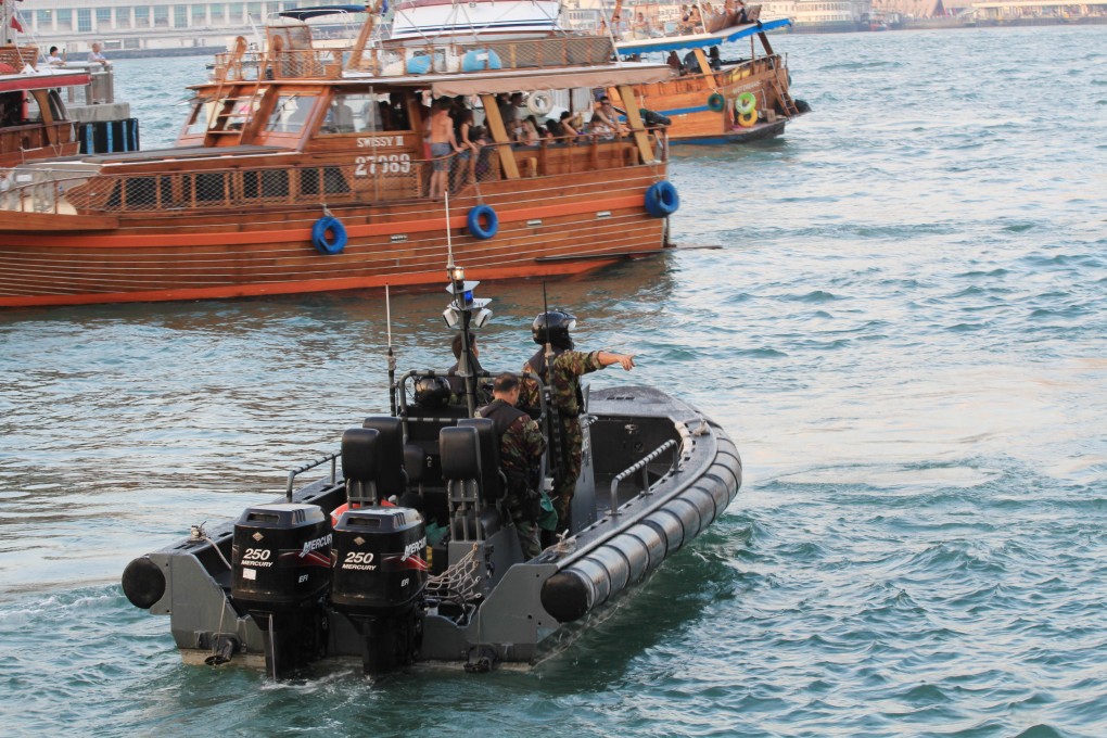 Police search for a man who fell from a junk near to Pier 10. Photo: SCMP