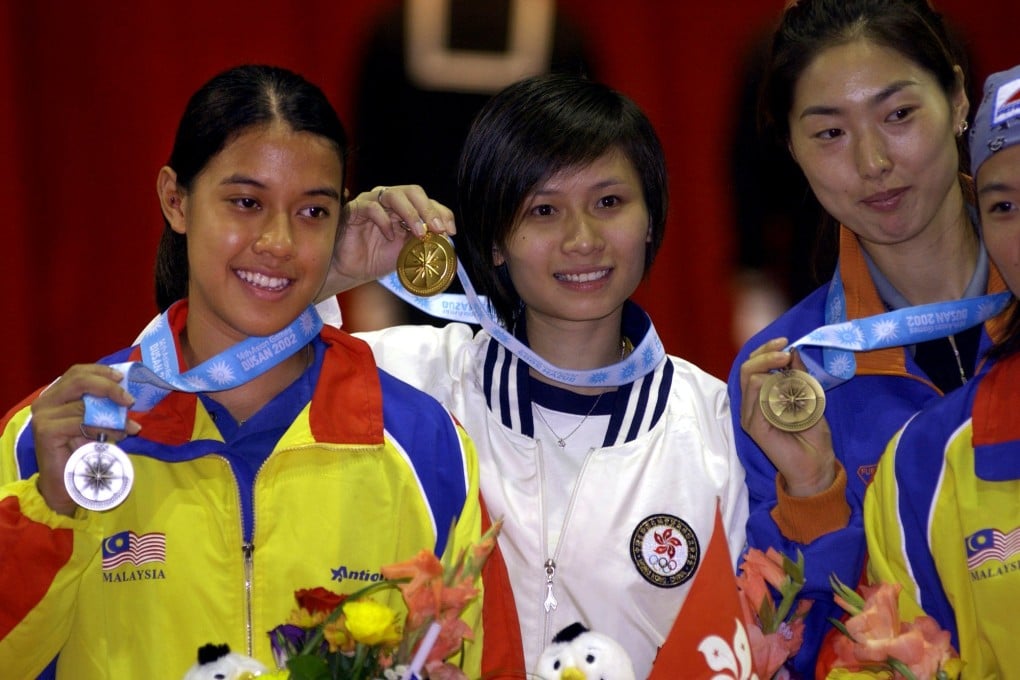 Flashback: Hong Kong's Rebecca Chiu celebrates her gold medal at the 2002 Busan Asian Games with her great rival, Nicol David, (left). Photo: Anthony Dickson