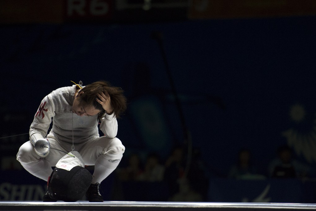 Hong Kong's Lin Po-heung put up a brave fight but lost 13-11 to China's Le Huilin in the semi-finals of the women's individual foil at the Asian Games. Photo: Xinhua